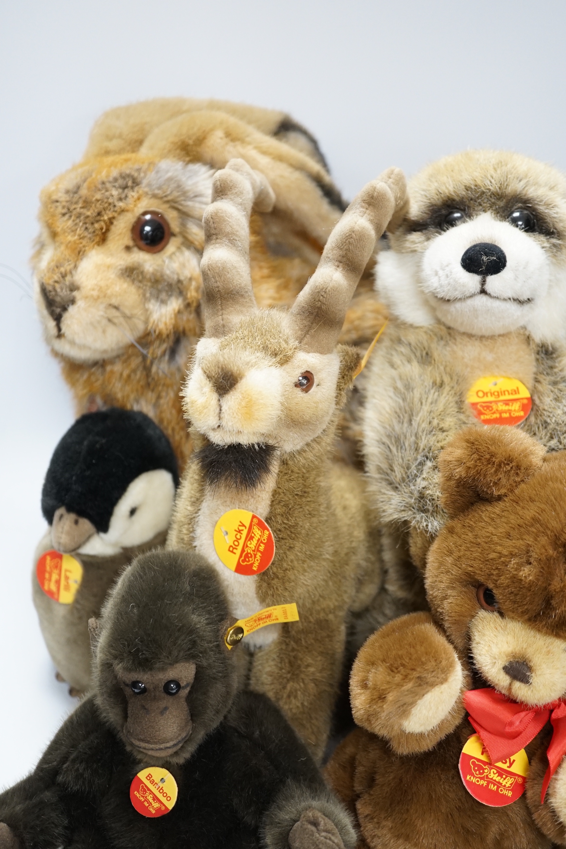 Seven Steiff animals, yellow tag: bear, Sigi badger, Rocky, Muneeb hare, Meerkat and others